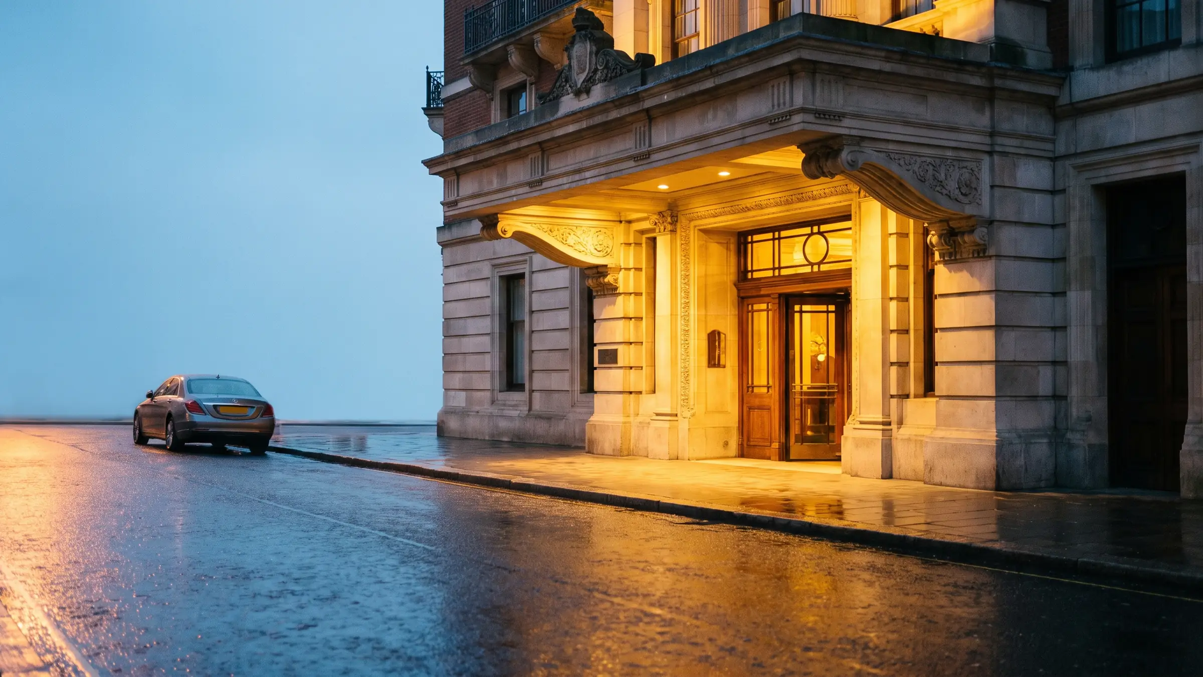 A warmly lit venue entrance in the evening